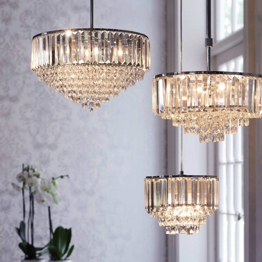 9 Light polished chrome chandelier with bevelled coffin glass crystal detailing.