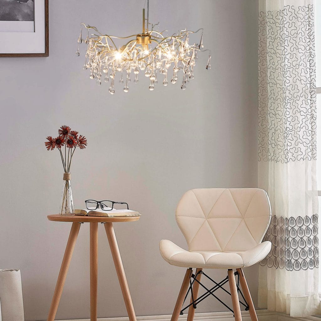 Modern Chandelier in a textured champagne gold stain finish with crystal droplets handing from each branch