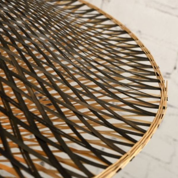 Woven bamboo disc table lamp close up