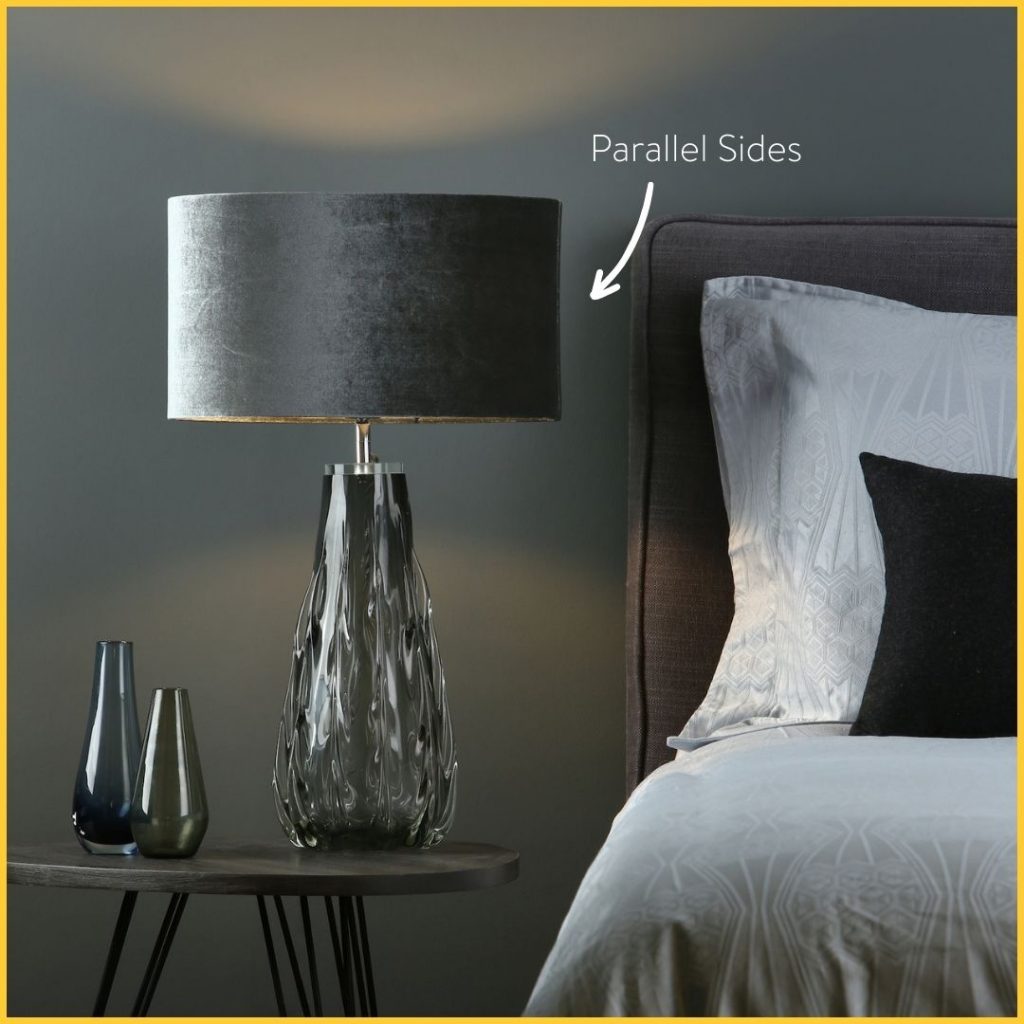 Grey drum shade on a smoked glass table lamp