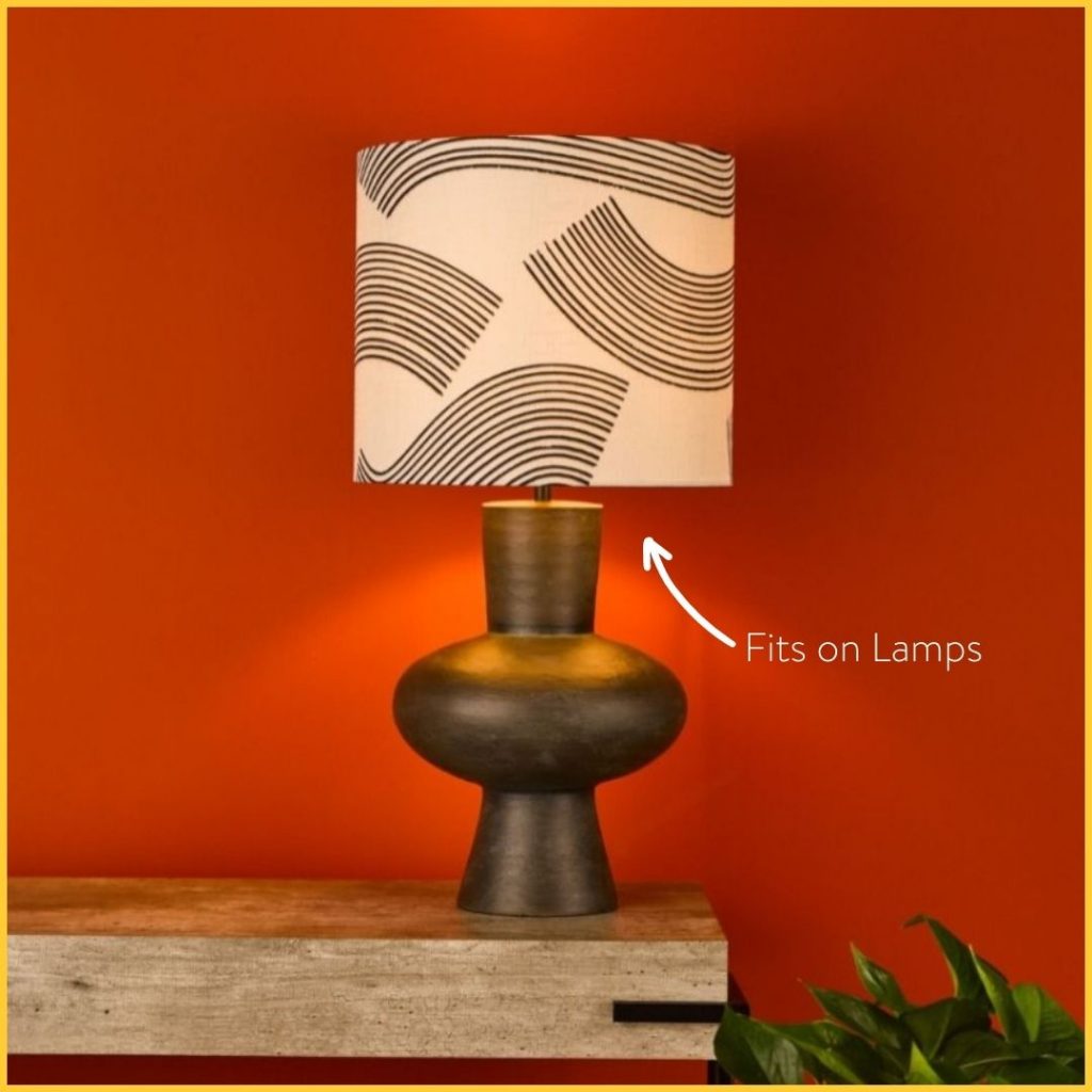 modern pottery style table lamp with narrow drum shade
