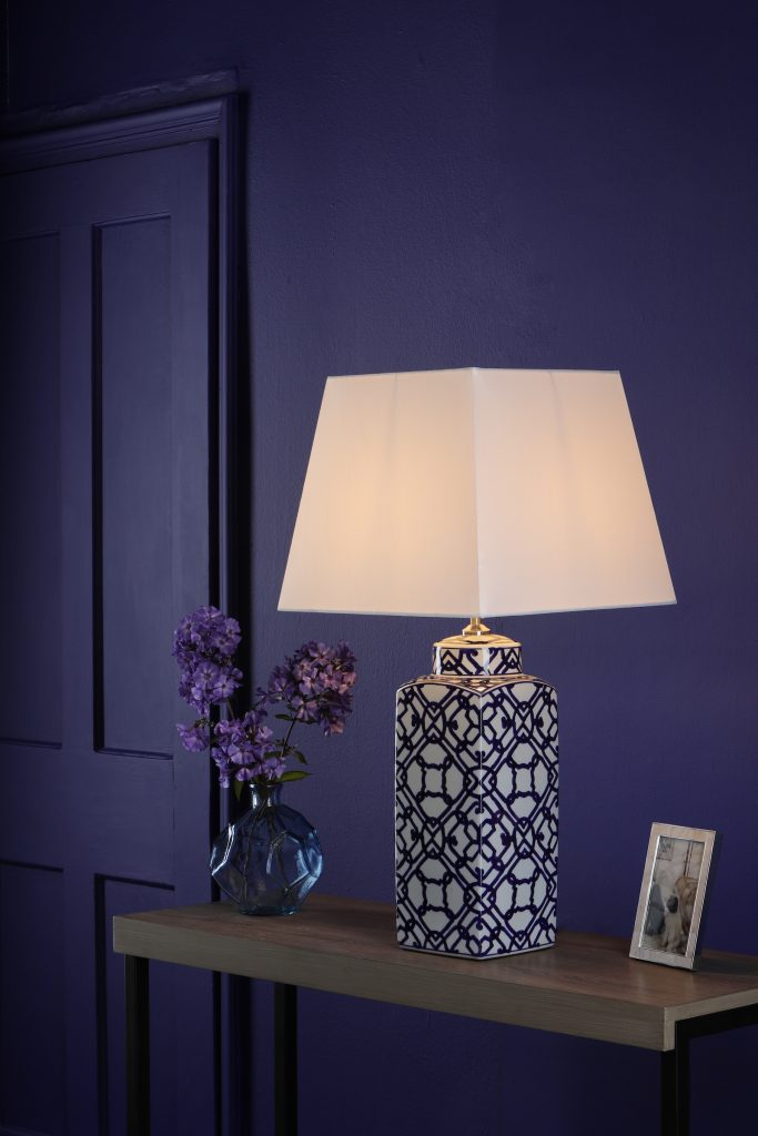 square lampshade on a blue and white ceramic table lamp