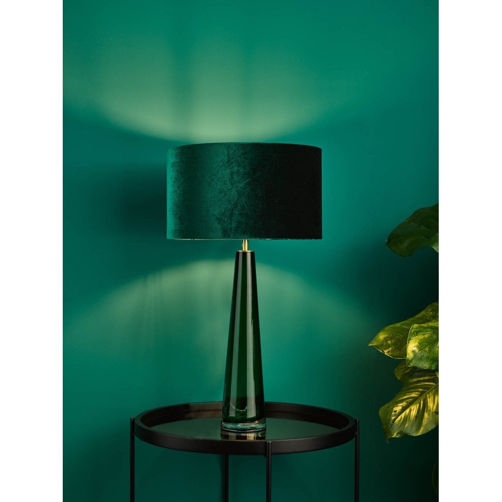 bottle green velvet drum shade on a green glass table lamp