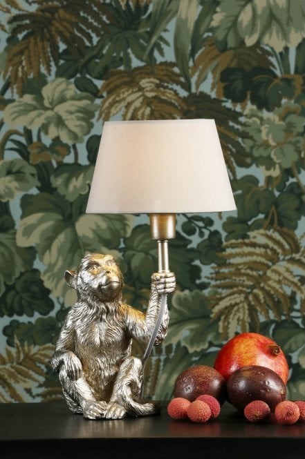 silver monkey holding lamp table lamp