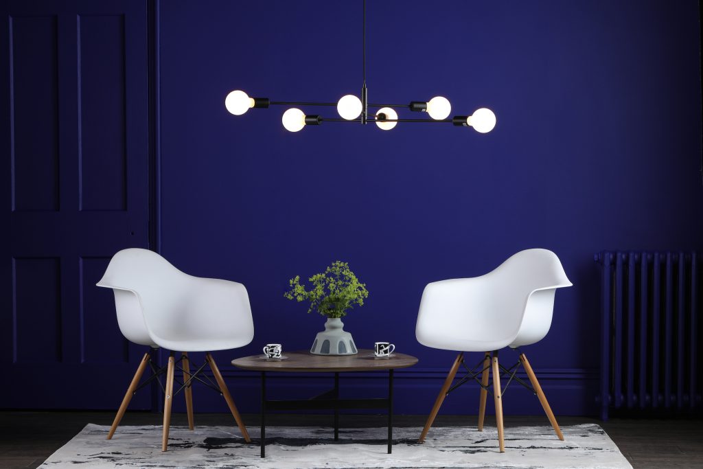 sputnik style ceiling light above coffee table