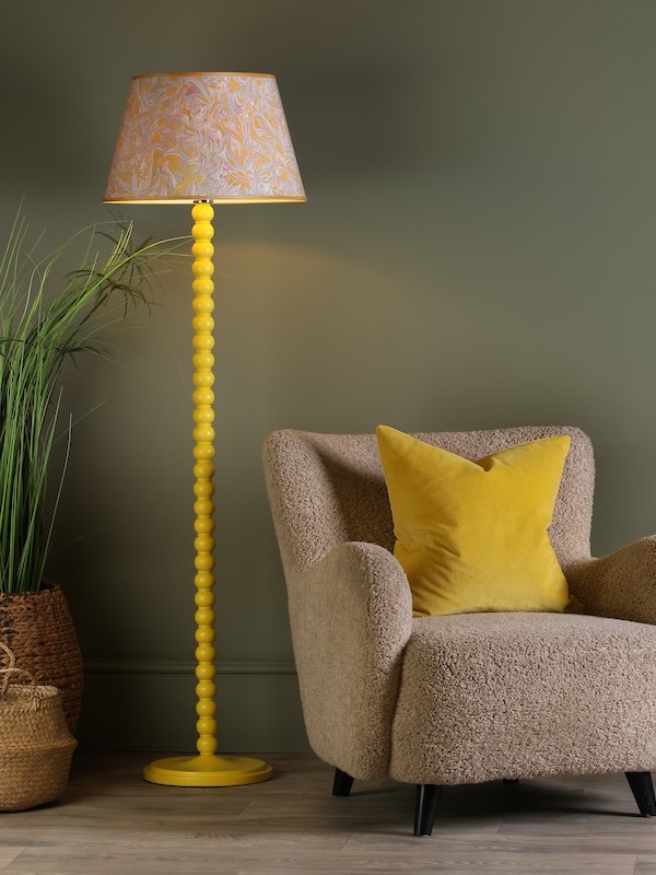 yellow bobbin inspired spool lamp with marble shade