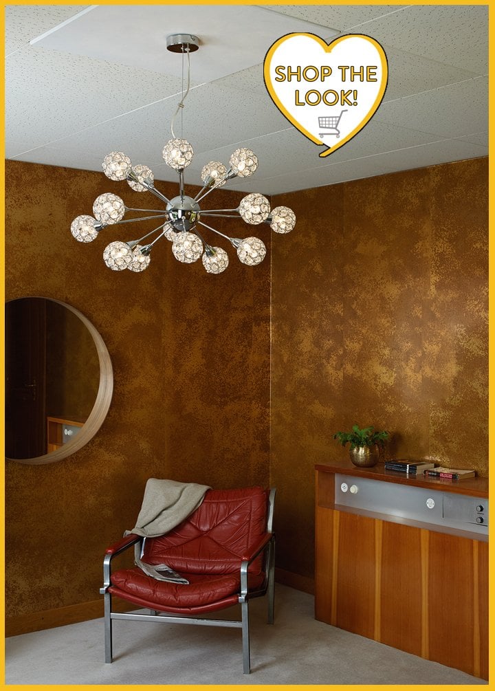 sputnik style light above red chair