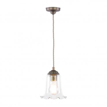 Pendant light in antique brass with clear glass shade