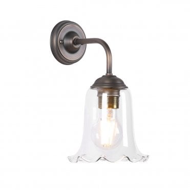 Wall light in antique brass with clear glass