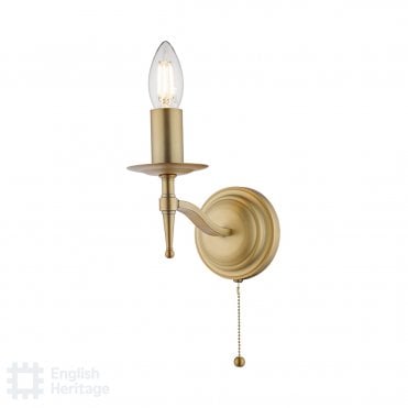 brass candlestick style wall light