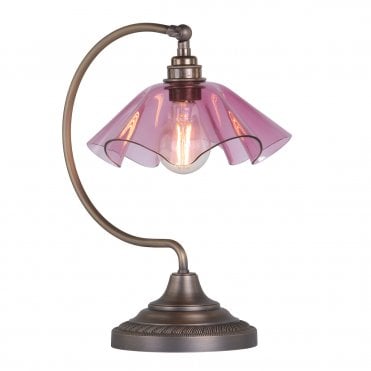 Table lamp in antique brass with pink glass shade