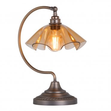 Table lamp in antique brass with tobacco glass shade