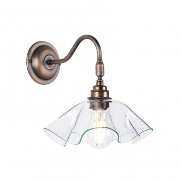 curved glass wall light with antique brass hardware
