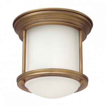 flush ceiling light with opal glass and a brushed bronze frame