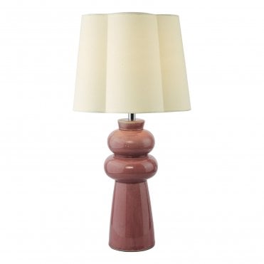 a pink ceramic lamp base with cream scalloped linen lamp shade 
