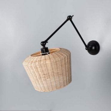 Matte black adjustable wall light with natural rattan shade