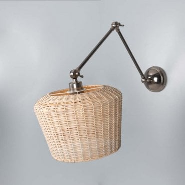 Antique silver adjustable arm wall light with rattan shade