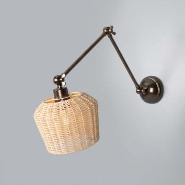 Antigue brass adjustable wall light with woven rattan shade