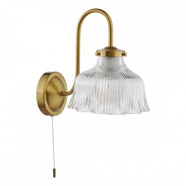 brass wall light with ribbed glass shade