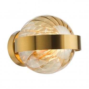wall light in a gold finish with textured amber glass shade