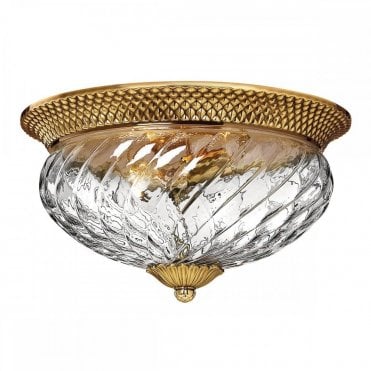 3 light flush mount with swirled glass and burnished brass