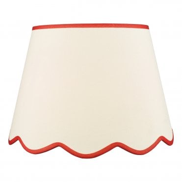 A large, neutral scallop shade lamp shade with red edge detail