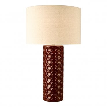 an oversized large red ceramic decorative table lamp with neutral ivoriy linen drum shade