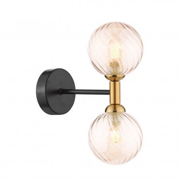 a modern wall light in a matt black and bronze finish with two bulbs featuring two decorative twisted amber glass globe shades